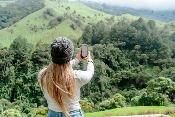 Latin woman traveler, blonde-haired and wearing a cap, enjoying her trip in Salento. Photography, travel and experiences.