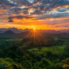 Scenic View of Mountains and Sunbeams Over Lush Green Foliage