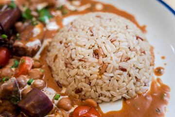 A vegetarian massaman curry in a bowl with sweet potato and many spices