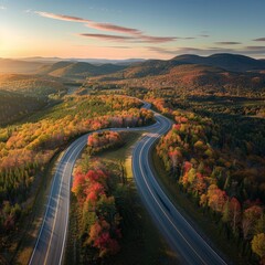 Aerial View of Highway Curving Through Autumn Hills