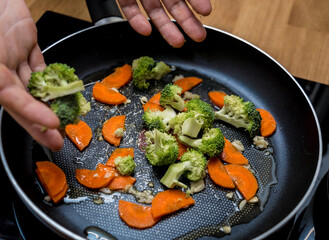 Chef at the kitchen preparing japanese buckwheat pasta with lentils