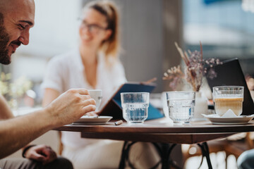 Startup team in business meeting discussing and brainstorming strategies while enjoying coffee. Concept of teamwork, collaboration, and creativity in a relaxed environment.