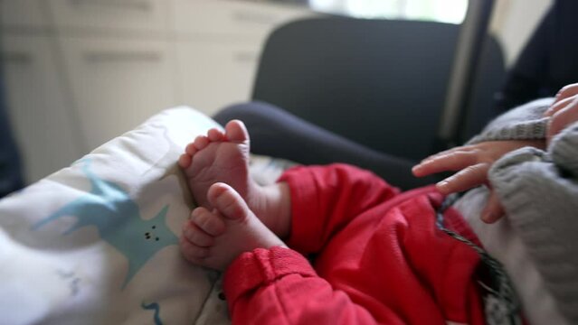 Baby resting peacefully in car seat, tiny feet visible in foreground, cozy and calm atmosphere, detailed close-up emphasizing soft baby toes, intimate and tender moment of relaxation