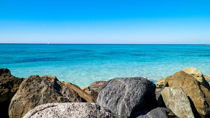 Stones on beach in Vada, Italy.