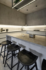 Kitchen in a villa in minimalism and loft style