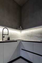 Kitchen in a villa in minimalism and loft style