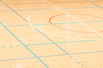 Wooden floor basketball, badminton, futsal, handball, volleyball, football, soccer court. Wooden floor of sports hall with marking lines on wooden floor indoor, gym court