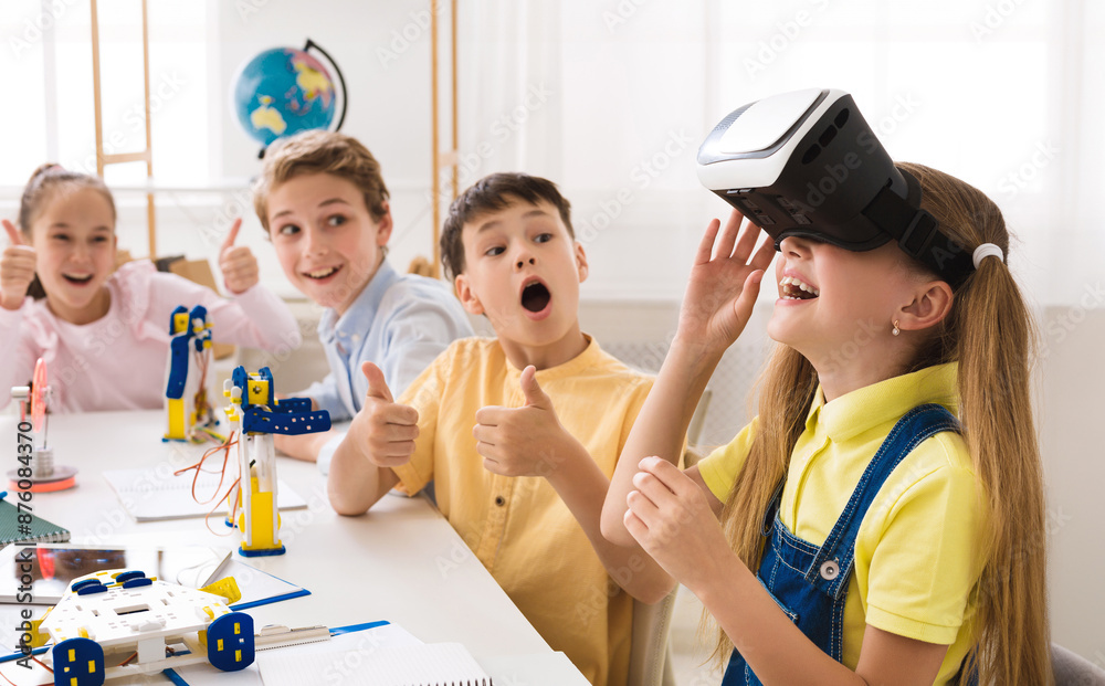 Poster a group of elementary school students are engaged in a stem class, with one student wearing a vr hea