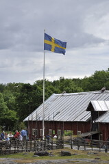 The Swedish flag on a windy, cloudy day.