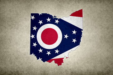 Map of the state of Ohio with its flag on a paper