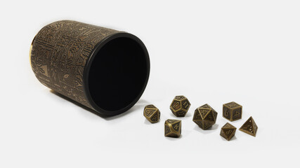 A set of metal polyhedral dice with a shaker cup