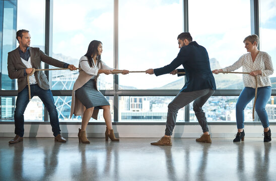 Business people, rope and pulling in office for challenge with tug of war, rival company and strong teamwork. Staff, collaboration and help with opposition, partnership and work competition or battle