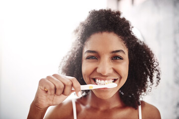 Woman, happy and portrait with brushing teeth in bathroom for dental hygiene, oral care and...