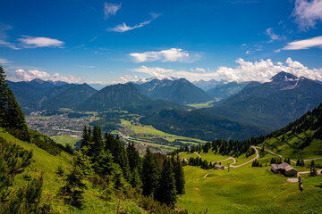 Fototapeta premium reutte, tyrol, mountains, alps, green, lake, landscape, nature, mountain view, alpine, clouds