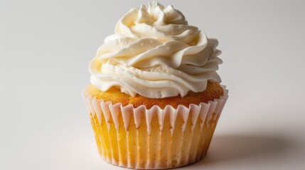 Tasty vanilla cupcake with creamy swirl on a white backdrop
