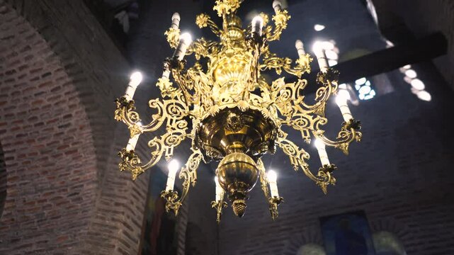 Christianity, religion and Faith. Inside the Christian cathedral during the service there are icons with a cross and drawings. Sacrament and ritual in a historical church