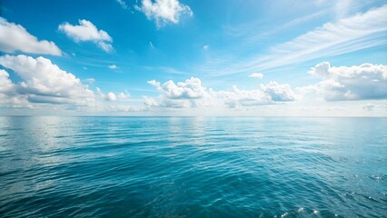 Obraz premium Ocean horizon with blue sky and fluffy clouds
