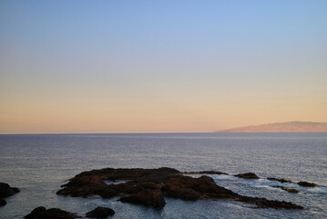 Atlantic Ocean and La Gomera Island view from Tenerife Island Spain at sunset