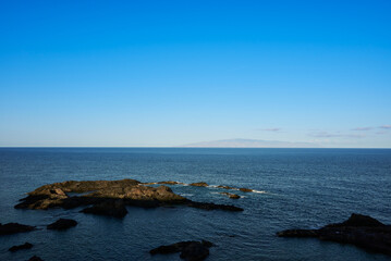 Atlantic Ocean and La Gomera Island view from Tenerife Island Spain at sunset