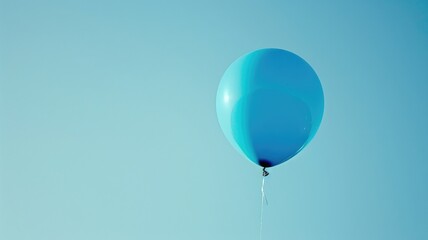 Fototapeta premium Single blue balloon floating against clear sky