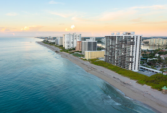 Luxury condos along the Florida Atlantic coast in Boca Raton, Florida during sunrise. 