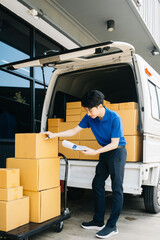 Asian courier delivery man searching the address on digital tablet.  near van outside the...