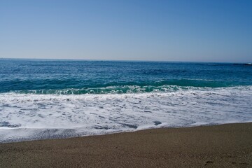 Landscape of Katsurahama beach with lapping waves and sea