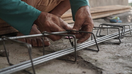 close up installing concrete steel reinforcement used for the casting process