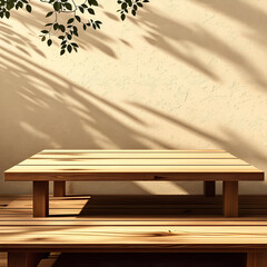 Empty wood table top on beige wall texture with tree leaves shadow background