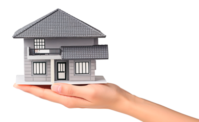 A woman's hand holding a home model isolated on transparent background. Concept of residential architeture presentation for customer.