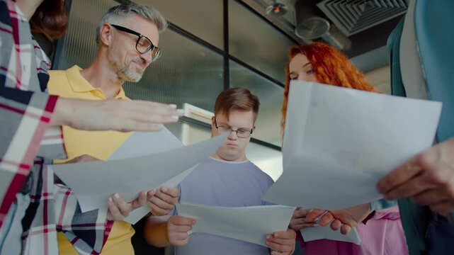 Man with developmental disability looking through document