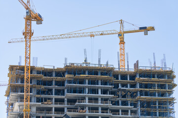 Tower cranes on the construction site