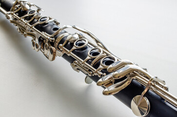 French system clarinet close-up on a light background