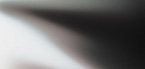 Diagonal gradient fading from white to black on abstract grainy texture background