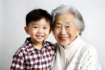 Asian Grandmother and Grandchild Smiling Together
