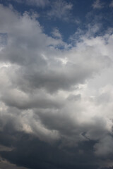 Blue sky. Beautiful Cumulus clouds flying across the sky,