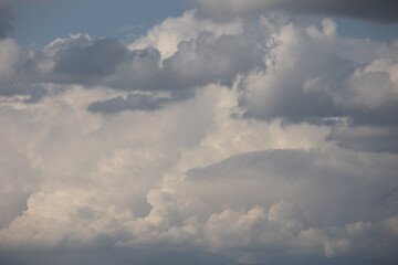 Blue sky. Beautiful Cumulus clouds flying across the sky,