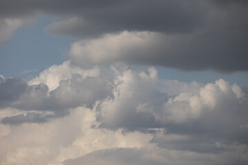 Obraz premium Blue sky. Beautiful Cumulus clouds flying across the sky,
