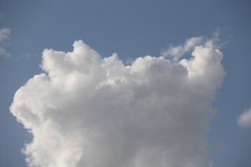 Blue sky. Beautiful Cumulus clouds flying across the sky,