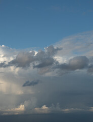 Obraz premium Blue sky. Beautiful Cumulus clouds flying across the sky,