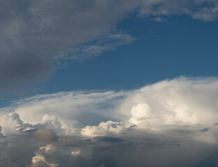 Blue sky. Beautiful Cumulus clouds flying across the sky,