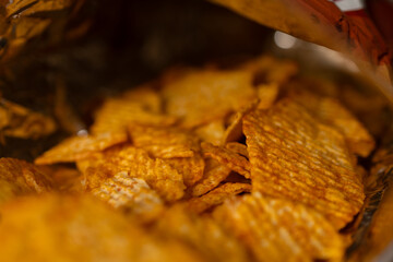 Packing of fluted chips. Fluted chips. Food. Texture. Wallpaper. Macro