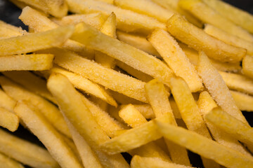 Close-up fries. Macro. Ice cubes and salt