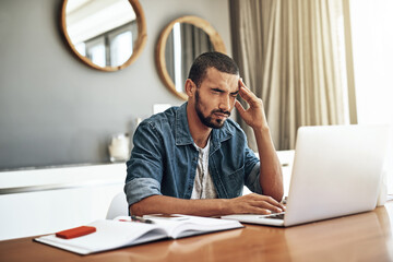 Naklejka premium Headache, laptop and man in living room with remote work for burnout, deadline or fatigue. Anxiety, journalist and freelancer for review article, proofreading or working on feature story in home