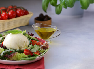 salad with burrata cheese on a plate