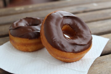 chocolate donuts on a napkin