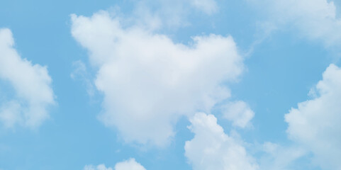 blue sky background with white clouds. White cumulus clouds formation in blue sky. White clouds and blue sky.  Panorama of blue sky with white clouds in sunny