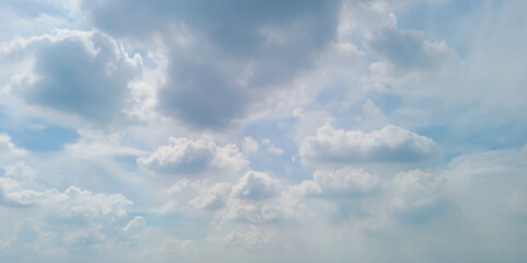 blue sky background with white clouds. White cumulus clouds formation in blue sky. White clouds and blue sky.  Panorama of blue sky with white clouds in sunny
