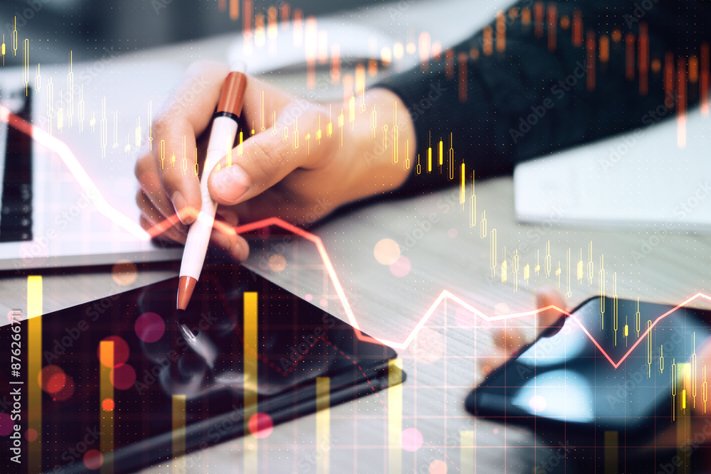 Poster close up of male hand using tablet and smartphone with downward red forex chart on blurry background