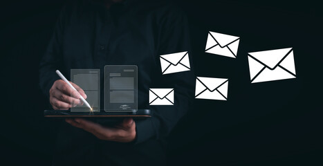Businessman uses smartphone and pencil to write and send electronic mail with virtual interface technology, Online communication concept, Communication business technology, Message E-mail Inbox,email